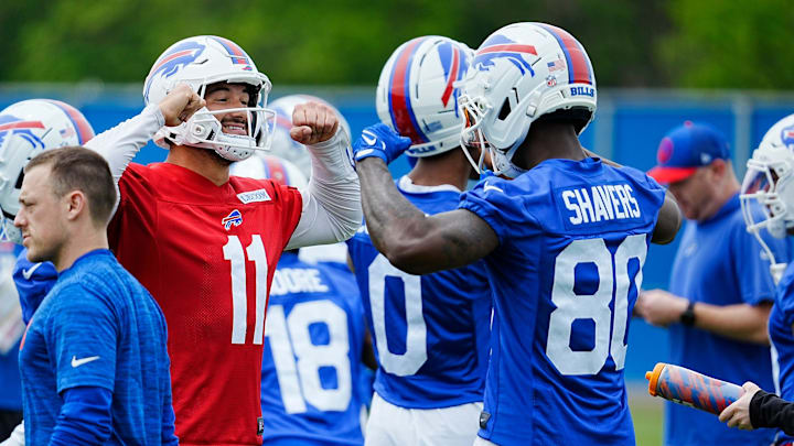 Buffalo Bills Mitchell Trubisky and Tyrell Shavers go through an elaborate handshake that also involves showing off muscles when they meet up in a smaller group where a different drill was being run at their practice facility on May 27, 2025.