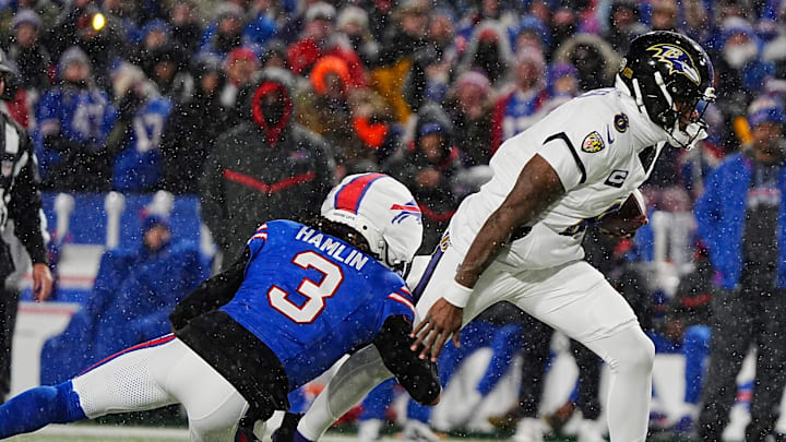 Buffalo Bills safety Damar Hamlin grabs a hold of Baltimore Ravens quarterback Lamar Jackson’s leg and sacks him.