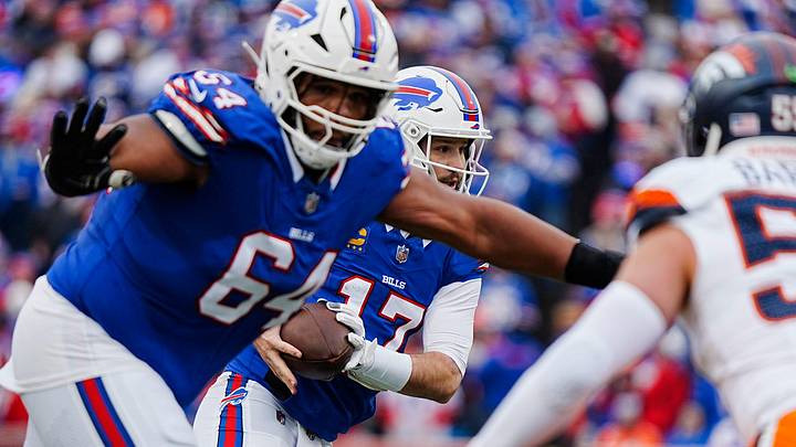 Buffalo Bills guard O'Cyrus Torrence tries to clear a path for Buffalo Bills quarterback Josh Allen.