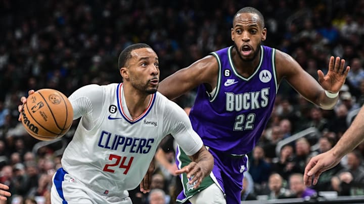Feb 2, 2023; Milwaukee, Wisconsin, USA; Los Angeles Clippers guard Norman Powell (24) drives to the basket against Milwaukee Bucks forward Khris Middleton (22) in the first quarter at Fiserv Forum. Mandatory Credit: Benny Sieu-Imagn Images