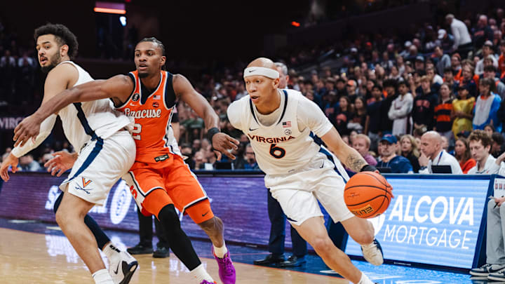 Feb 7, 2026; Charlottesville, Virginia, USA; Virginia Cavaliers guard Jacari White (6) dribbles the ball while Syracuse Orange guard JJ Starling (2) defends during the second half at John Paul Jones Arena. Mandatory Credit: Emily Faith Morgan-Imagn Images