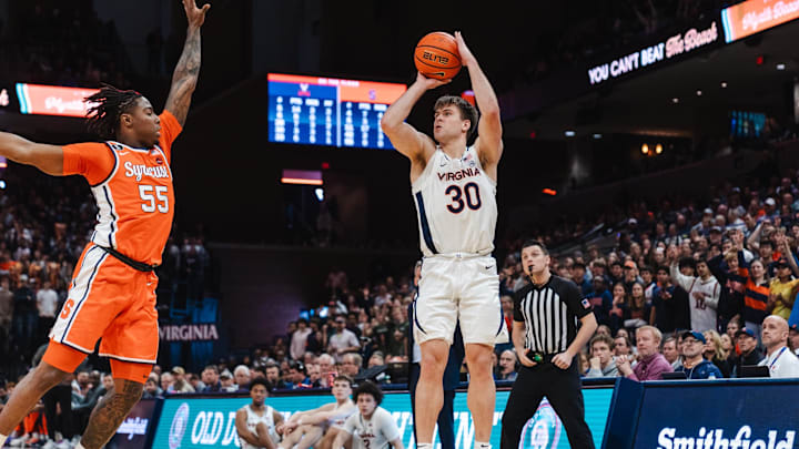 Feb 7, 2026; Charlottesville, Virginia, USA; Virginia Cavaliers guard Dallin Hall (30) shoots the ball while Syracuse Orange guard Bryce Zephir (55) defends during the second half at John Paul Jones Arena. Mandatory Credit: Emily Faith Morgan-Imagn Images