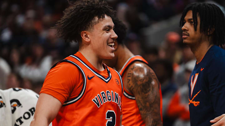 Feb 21, 2026; Charlottesville, Virginia, USA; Virginia Cavaliers guard Chance Mallory (2) celebrates with teammates during the first half against the Miami (FL) Hurricanes at John Paul Jones Arena. Mandatory Credit: Emily Faith Morgan-Imagn Images