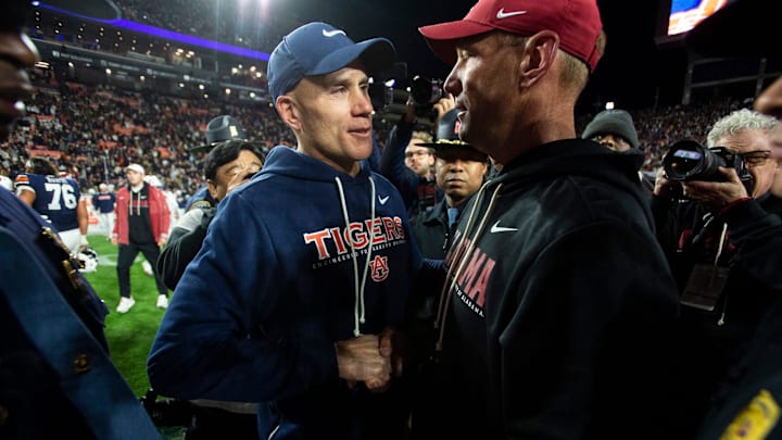 Auburn Tigers interim head coach DJ Durkin and Alabama Crimson Tide head coach Kalen DeBoer shake hands after the game as Auburn Tigers take on Alabama Crimson Tide in the Iron Bowl at Jordan-Hare Stadium in Auburn, Ala. on Saturday, Nov. 29, 2025. Alabama Crimson Tide defeated Auburn Tigers 27-20. Auburn Tigers interim head coach DJ Durkin and Alabama Crimson Tide head coach Kalen DeBoer shake hands after the game as Auburn Tigers take on Alabama Crimson Tide in the Iron Bowl at Jordan-Hare Stadium in Auburn, Ala. on Saturday, Nov. 29, 2025. Alabama Crimson Tide defeated Auburn Tigers 27-20.
