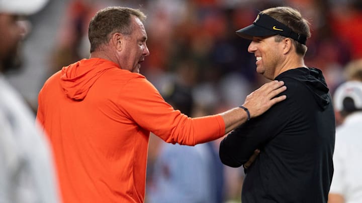 Auburn Tigers head coach Hugh Freeze and Missouri Tigers head coach Eli Drinkwitz talk during warm ups before Auburn Tigers take on Missouri Tigers at Jordan-Hare Stadium in Auburn, Ala. on Saturday, Oct. 18, 2025. Auburn Tigers head coach Hugh Freeze and Missouri Tigers head coach Eli Drinkwitz talk during warm ups before Auburn Tigers take on Missouri Tigers at Jordan-Hare Stadium in Auburn, Ala. on Saturday, Oct. 18, 2025.