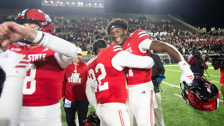 Jacksonville State Gamecocks defensive lineman Talan Carter (92) and wide receiver Deondre Johnson (11) celebrate victory as Troy Trojans take on Jacksonville State Gamecocks during the IS4S Salute to Veterans Bowl at Cramton Bowl in Montgomery, Ala. on Wednesday, Dec. 17, 2025. Jacksonville State Gamecocks defeated Troy Trojans 17-13.
