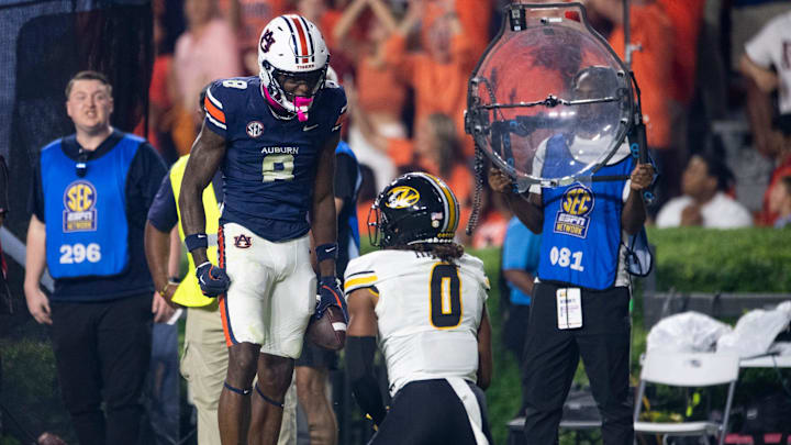 Auburn Tigers wide receiver Cam Coleman (8) celebrates his catch over Missouri Tigers defensive back Stephen Hall (0) as Auburn Tigers take on Missouri Tigers at Jordan-Hare Stadium in Auburn, Ala. on Saturday, Oct. 18, 2025. Missouri Tigers defeated the Auburn Tigers 23-17 in 2OT.