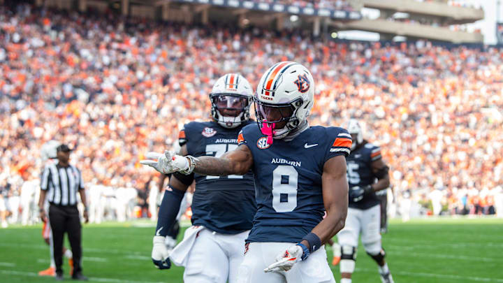 Auburn Tigers wide receiver Cam Coleman (8) celebrates his touchdown as Auburn Tigers take on Mercer Bears at Jordan-Hare Stadium in Auburn, Ala. on Saturday, Nov. 22, 2025. Auburn Tigers lead the Mercer Bears 35-17 at halftime.