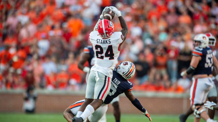 Georgia Bulldogs defensive back Malaki Starks (24) makes the game sealing interception as Auburn Tigers take on Georgia Bulldogs at Jordan-Hare Stadium in Auburn, Ala., on Saturday, Sept. 30, 2023. Georgia Bulldogs defeated Auburn Tigers 27-20. Georgia Bulldogs defensive back Malaki Starks (24) makes the game sealing interception as Auburn Tigers take on Georgia Bulldogs at Jordan-Hare Stadium in Auburn, Ala., on Saturday, Sept. 30, 2023. Georgia Bulldogs defeated Auburn Tigers 27-20.