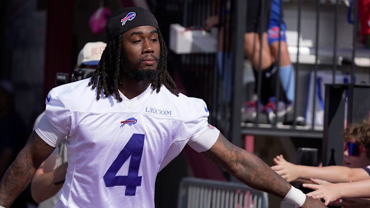 Buffalo Bills running back James Cook runs by slapping hands with out held hands as he heads to the field during the Buffalo Bills training camp at St. John Fisher University in Pittsford on July 24, 2025.