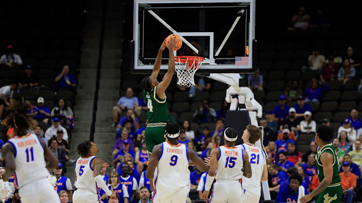 South Florida Bulls guard Kobe Knox (4) dunks during the first half of an NCAA men’s basketball matchup Monday, Nov. 4, 2024 at VyStar Veterans Memorial Arena in Jacksonville, Fla. [Corey Perrine/Florida Times-Union]