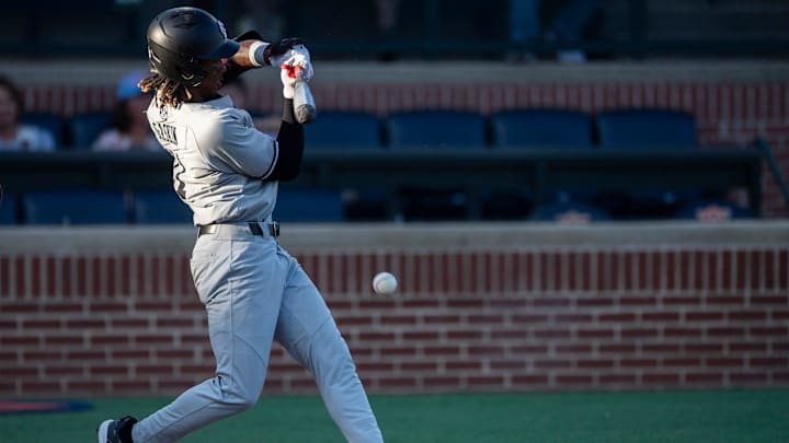 South Carolina Gamecocks' Cayden Gaskin (11) hits the ball as the Auburn Tigers take on South Carolina Gamecocks at Plainsman Park in Auburn, Ala., on Thursday, May 8, 2025.