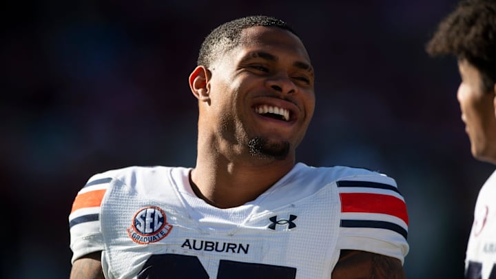 Auburn Tigers running back Jarquez Hunter (27) jokes with teammates during warm ups as Auburn Tigers take on Alabama Crimson Tide at Bryant-Denny Stadium in Tuscaloosa, Ala., on Saturday, Nov. 30, 2024.