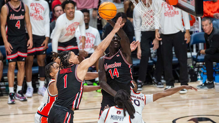 Houston Cougars forward Kalifa Sakho (14) tips a rebound out as Auburn Tigers take on the Houston Cougars at Legacy Arena in Birmingham, Ala. on Sunday, Nov. 16, 2025. Houston Cougars defeated Auburn Tigers 73-72.