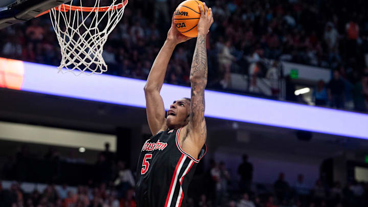 Houston Cougars center Chris Cenac Jr. (5) dunks the ball as Auburn Tigers take on the Houston Cougars at Legacy Arena in Birmingham, Ala. on Sunday, Nov. 16, 2025. Houston Cougars defeated Auburn Tigers 73-72.
