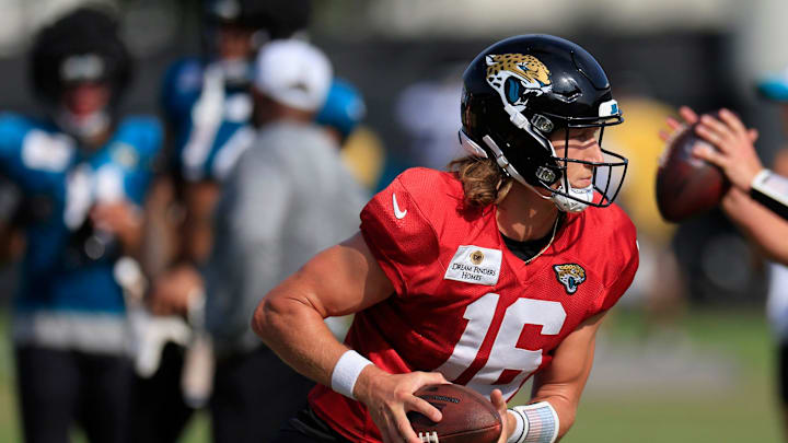 Jacksonville Jaguars quarterback Trevor Lawrence (16) looks to handoff during the seventh day of an NFL football training camp practice Wednesday, July 31, 2024 at EverBank Stadium’s Miller Electric Center in Jacksonville, Fla.