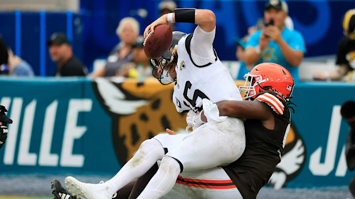 Cleveland Browns defensive end Alex Wright (91) sacks Jacksonville Jaguars quarterback Trevor Lawrence (16) in the end zone for a safety during the fourth quarter of an NFL football matchup Sunday, Sept. 15, 2024 at EverBank Stadium in Jacksonville, Fla. The Browns defeated the Jaguars 18-13.