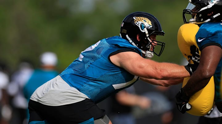 Jacksonville Jaguars offensive tackle Walker Little (72), left, drills with offensive tackle Cam Robinson (74) during the third day of an NFL football training camp practice Friday, July 26, 2024 at EverBank Stadium’s Miller Electric Center in Jacksonville, Fla.