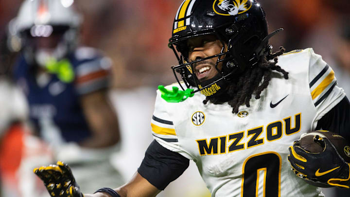 Missouri Tigers wide receiver Joshua Manning (0) runs the ball as the Auburn Tigers take on the Missouri Tigers at Jordan-Hare Stadium in Auburn, Ala., on Saturday, Oct. 18, 2025. The Missouri Tigers defeated the Auburn Tigers 23-17 in 2OT. Missouri Tigers wide receiver Joshua Manning (0) runs the ball as the Auburn Tigers take on the Missouri Tigers at Jordan-Hare Stadium in Auburn, Ala., on Saturday, Oct. 18, 2025. The Missouri Tigers defeated the Auburn Tigers 23-17 in 2OT.