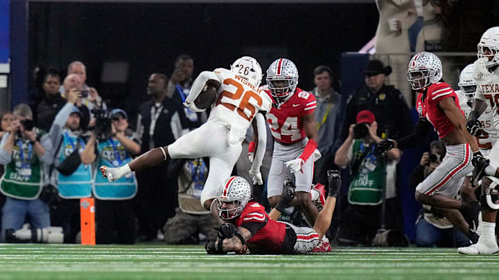 Ohio State Buckeyes safety Lathan Ransom (8) tackles Texas Longhorns running back Quintrevion Wisner (26) near the goal line in the fourth quarter of the Cotton Bowl Classic during the College Football Playoff semifinal game at AT&T Stadium in Arlington, Texas on January, 10, 2025.