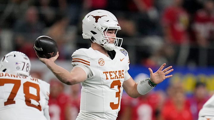 Texas Longhorns quarterback Quinn Ewers (3) throws the ball against Ohio State Buckeyes defense in the first quarter of the Cotton Bowl Classic during the College Football Playoff semifinal game at AT&T Stadium in Arlington, Texas on January, 10, 2025.