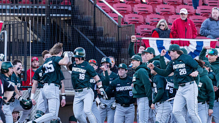 The Michigan State team celebrates the go-ahead run at Jim Patterson Stadium as the Spartans defeated the Louisville Cardinals 4–3 in the season opener in Louisville, Ky., on Friday, Feb. 13, 2026.