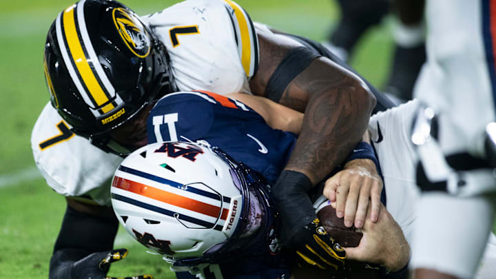 Missouri Tigers defensive tackle and Packers draft pick Chris McClellan sacks Auburn Tigers quarterback Jackson Arnold.