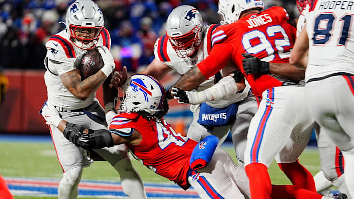 New England Patriots running back Antonio Gibson gets tackled by Buffalo Bills linebacker Dorian Williams. New England Patriots running back Antonio Gibson gets tackled by Buffalo Bills linebacker Dorian Williams.