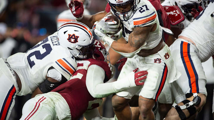 Auburn Tigers running back Jarquez Hunter (27) runs in on a two-point conversion as Auburn Tigers take on Alabama Crimson Tide at Bryant-Denny Stadium in Tuscaloosa, Ala., on Saturday, Nov. 30, 2024. Alabama Crimson Tide defeated Auburn Tigers 28-14.