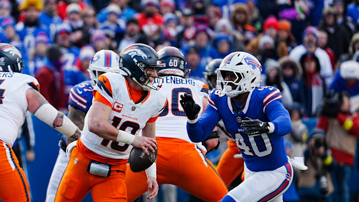Buffalo Bills linebacker Von Miller rushes towards Denver Broncos quarterback Bo Nix.