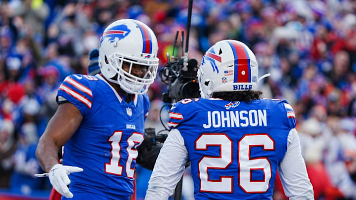 Buffalo Bills wide receiver Amari Cooper (18) celebrates with Buffalo Bills running back Ty Johnson (26) Johnson’s touchdown during the second half of the Buffalo Bills wild card game against the Denver Broncos at Highmark Stadium in Orchard Park on Jan. 12, 2025.