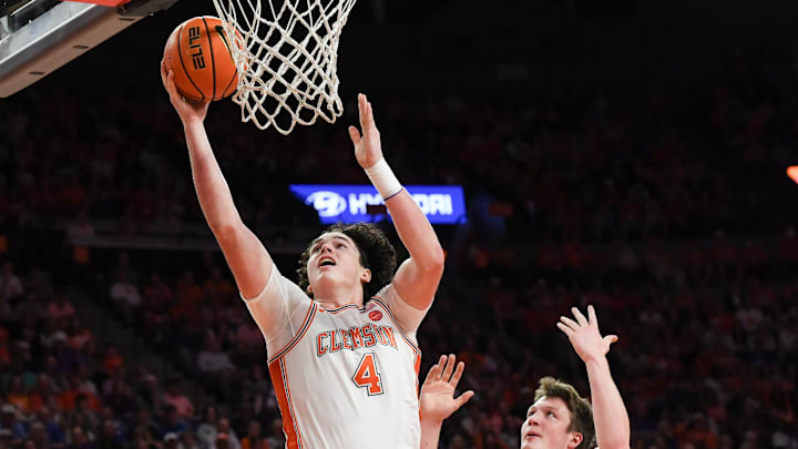 Feb 8, 2025; Clemson, South Carolina, USA; Clemson Tigers forward Ian Schieffelin (4) scores near Duke Blue Devils guard Kon Knueppel (7) during the first half at Littlejohn Coliseum. Mandatory Credit: Ken Ruinard/USA Today Network via magn Images Feb 8, 2025; Clemson, South Carolina, USA; Clemson Tigers forward Ian Schieffelin (4) scores near Duke Blue Devils guard Kon Knueppel (7) during the first half at Littlejohn Coliseum. Mandatory Credit: Ken Ruinard/USA Today Network via magn Images