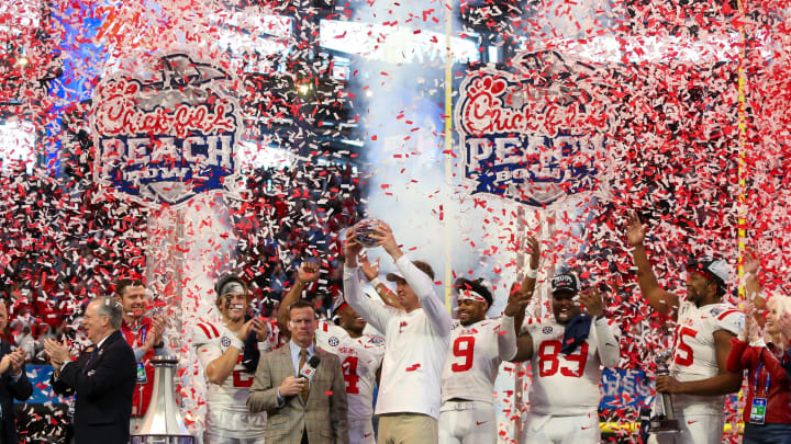 Dec 30, 2023; Atlanta, GA, USA; Mississippi Rebels head coach Lane Kiffin holds up the Peach Bowl trophy after a victory against the Penn State Nittany Lions at Mercedes-Benz Stadium. Mandatory Credit: Brett Davis-USA TODAY Sports
Dec 30, 2023; Atlanta, GA, USA; Mississippi Rebels head coach Lane Kiffin holds up the Peach Bowl trophy after a victory against the Penn State Nittany Lions at Mercedes-Benz Stadium. Mandatory Credit: Brett Davis-USA TODAY Sports