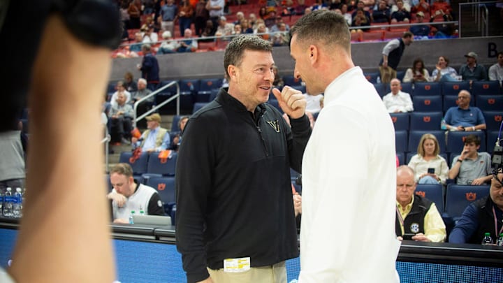 Vanderbilt Commodores head coach Mark Byington and Auburn Tigers head coach Steven Pearl talk before the game as Auburn Tigers take on Vanderbilt Commodores at Neville Arena in Auburn, Ala. on Tuesday, Feb. 10, 2026.