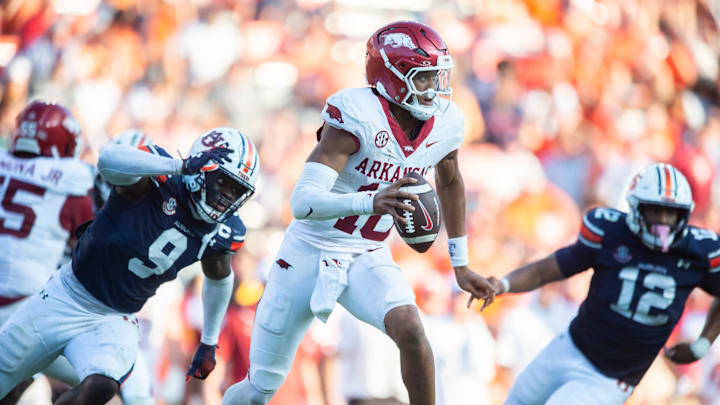 Arkansas Razorbacks quarterback Taylen Green (10) scrambles under pressure from Auburn Tigers linebacker Eugene Asante (9) as Auburn Tigers take on Arkansas Razorbacks at Jordan-Hare Stadium in Auburn, Ala., on Saturday, Sept. 21, 2024. Arkansas Razorbacks defeated Auburn Tigers 24-14. Arkansas Razorbacks quarterback Taylen Green (10) scrambles under pressure from Auburn Tigers linebacker Eugene Asante (9) as Auburn Tigers take on Arkansas Razorbacks at Jordan-Hare Stadium in Auburn, Ala., on Saturday, Sept. 21, 2024. Arkansas Razorbacks defeated Auburn Tigers 24-14.