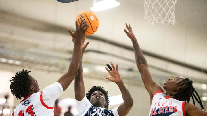 North All-Star's Kaleb Carson (11) is blocked by South All-Star's Gage Mayfield (13) during the AHSAA All-Star boys basketball game at Cramton Bowl Multiplex in Montgomery, Ala. on Tuesday, July 22, 2025. South All-Stars defeated North All-Stars 76-65.