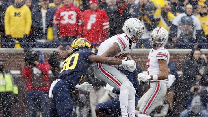 Ohio State Buckeyes wide receiver Jaxon Smith-Njigba (11) makes a catch against Michigan Wolverines defensive back Daxton Hill (30) 