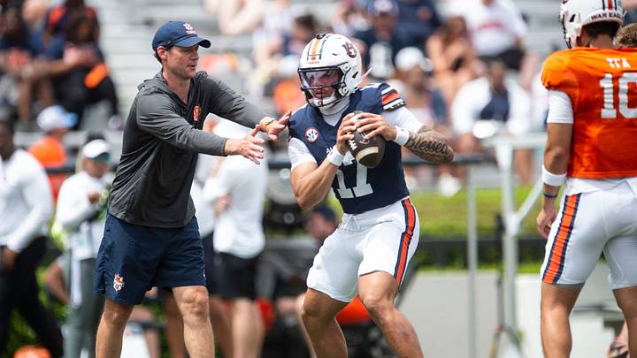 Auburn Tigers offensive coordinator Joel Gordon runs drills with Auburn Tigers quarterback Byrum Brown (17) during warm ups before Auburn Tigers A-Day spring game at Jordan-Hare Stadium in Auburn, Ala. on Saturday, April 18, 2026. Auburn Tigers offensive coordinator Joel Gordon runs drills with Auburn Tigers quarterback Byrum Brown (17) during warm ups before Auburn Tigers A-Day spring game at Jordan-Hare Stadium in Auburn, Ala. on Saturday, April 18, 2026.