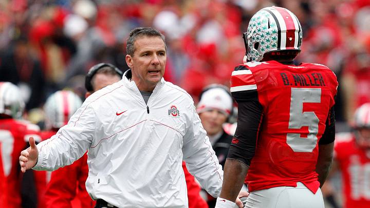 Ohio State Buckeyes head coach Urban Meyer and Ohio State Buckeyes quarterback Braxton Miller (5) against Michigan Wolverines at Ohio Stadium on November 24, 2012. Ohio State Buckeyes head coach Urban Meyer and Ohio State Buckeyes quarterback Braxton Miller (5) against Michigan Wolverines at Ohio Stadium on November 24, 2012.
