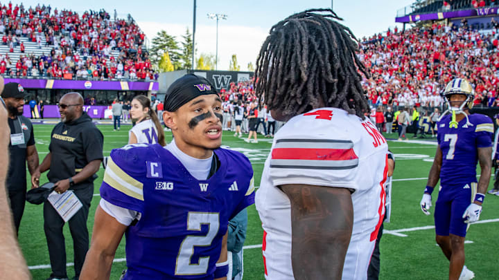 Demond Williams Jr. and wide receiver Jeremiah Smith meet after the UW-Ohio State game.