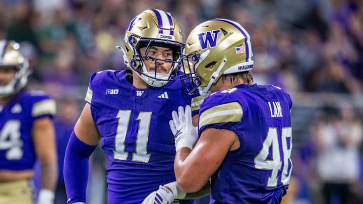 Ta'ita'i Uiagalelei (11) and Jacob Lane confer on the field. 