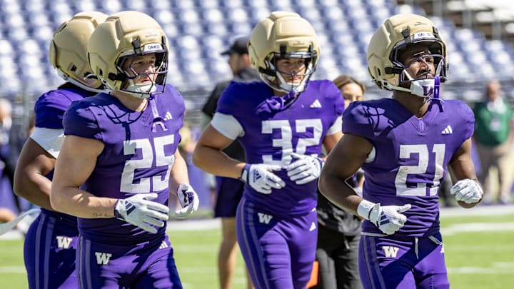 Quaid Carr (21) is a redshirt freshman running back, shown with walk-ons Beck Walker (25) and Ryken Moon (32).