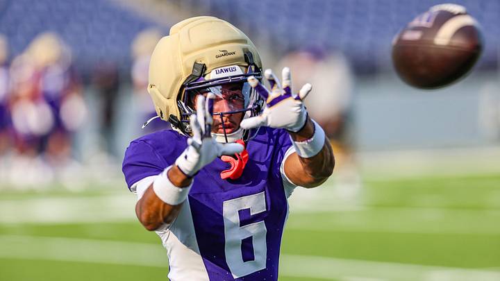 Mason James wore a retro Husky jersey to Saturday's scrimmage. Mason James wore a retro Husky jersey to Saturday's scrimmage.