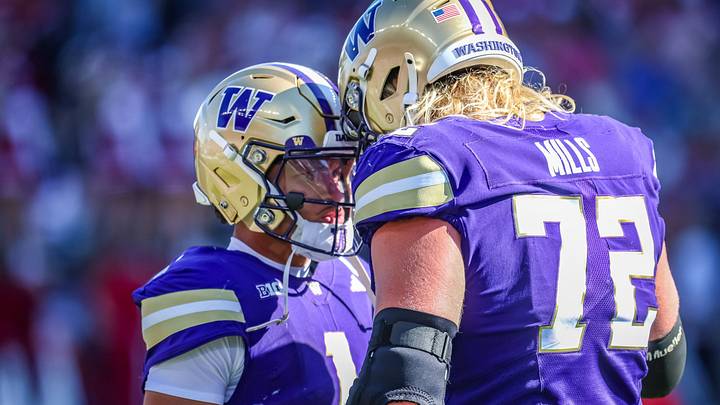 Demond Williams Jr. and John Mills have a UW game-day moment. Demond Williams Jr. and John Mills have a UW game-day moment.