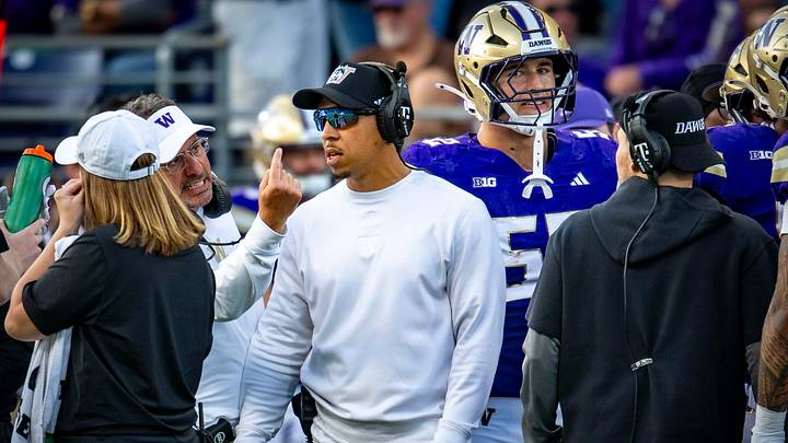 Jedd Fisch, gesturing, and Ryan Walters, sunglasses, haven't been happy about the spate of UW 15-yard penalties.