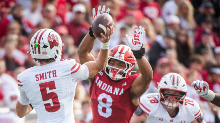 Indiana's Stephen Daly (8) pressures Wisconsin's Carter Smith (5) during the Indiana versus Wiscsonsin football game at Memorial Stadium on Saturday, Nov. 15, 2025.