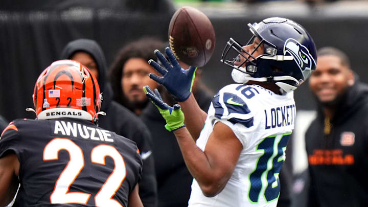 Seattle Seahawks wide receiver Tyler Lockett (16) catches a pass along the sideline as Cincinnati Bengals cornerback Chidobe Awuzie (22) defends in the second quarter during an NFL football game between the Seattle Seahawks and the Cincinnati Bengals Sunday, Oct. 15, 2023, at Paycor Stadium in Cincinnati.