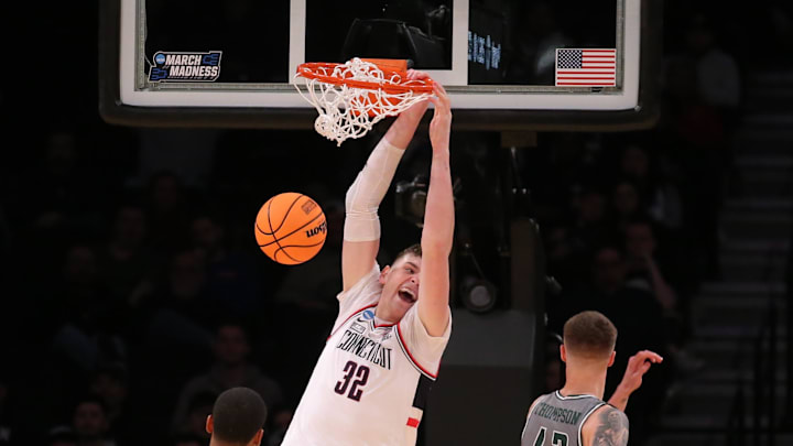 March 22, 2024, Brooklyn, NY, USA; Connecticut Huskies center Donovan Clingan (32) dunks against March 22, 2024, Brooklyn, NY, USA; Connecticut Huskies center Donovan Clingan (32) dunks against