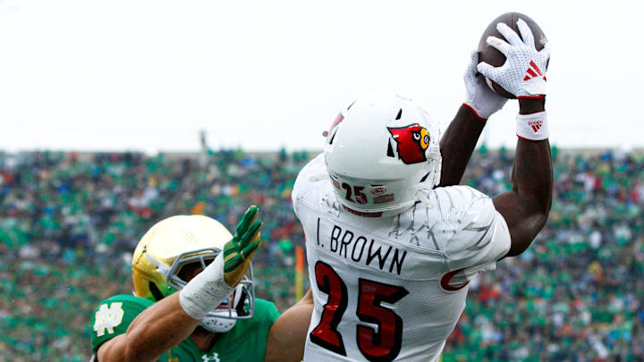 Louisville running back Isaac Brown (25) catches a pass for a touchdown with Notre Dame linebacker Jack Kiser (24) chasing during a NCAA college football game between Notre Dame and Louisville at Notre Dame Stadium on Saturday, Sept. 28, 2024, in South Bend.