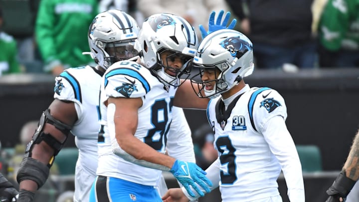 Dec 8, 2024; Philadelphia, Pennsylvania, USA; Carolina Panthers tight end Tommy Tremble (82) celebrates his touchdown catch with quarterback Bryce Young (9) against the Philadelphia Eagles during the second quarter at Lincoln Financial Field. Mandatory Credit: Eric Hartline-Imagn Images